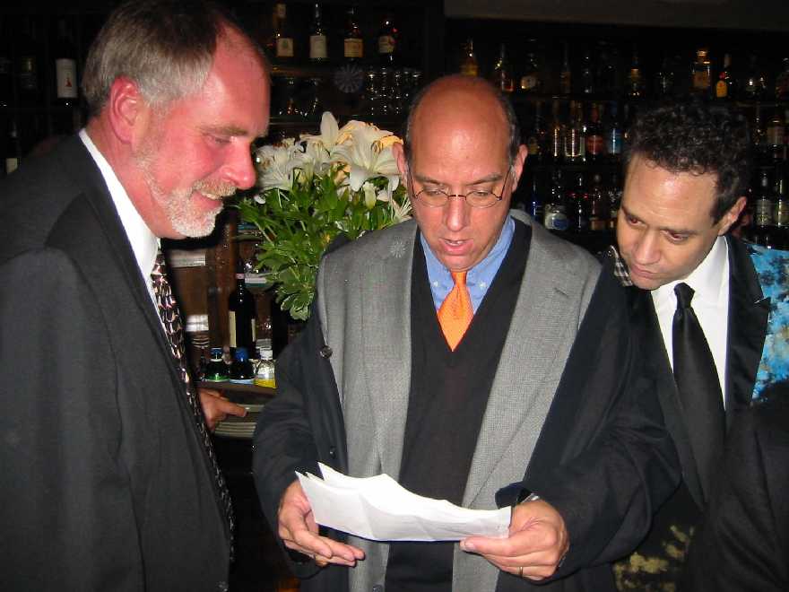 Rosemary's cousin Ben shows Gabri and Mark a photo of a chandelier that was given to Rosemary by Jose many years ago